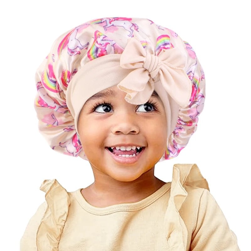 New Kids Unicorn Satin Bonnet with Wide Elastic Band and Ribbon, Perfect for Curly and Natural Hair, Perfect as a Nightcap, Shower Cap, or Headscarf. One Size; Imported.