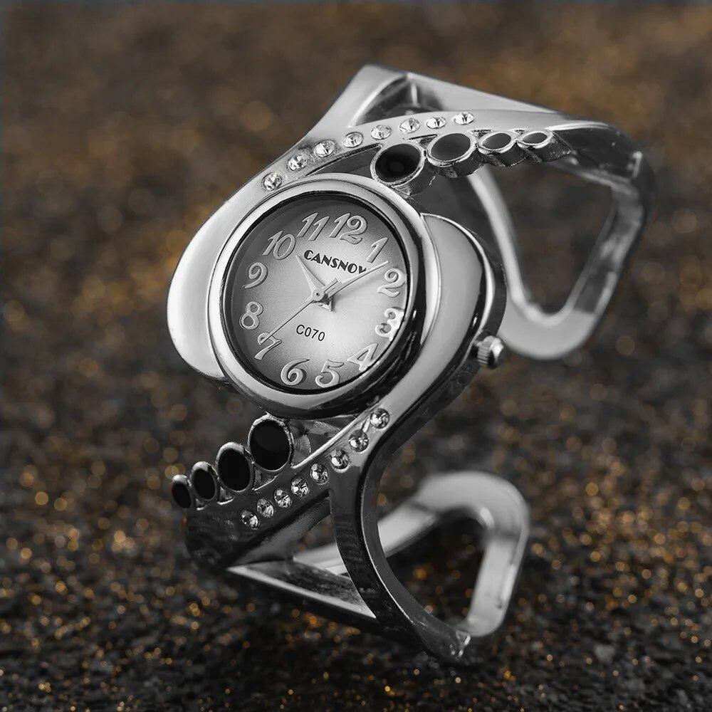 New Design Women's Bangle Quartz Wristwatch with Crystal and Rhinestone Detail. Popular and Elegant. Imported.