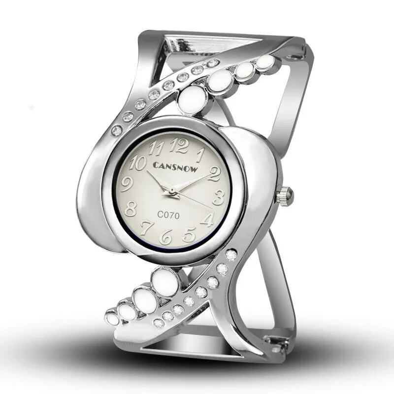 New Design Women's Bangle Quartz Wristwatch with Crystal and Rhinestone Detail. Popular and Elegant. Imported.