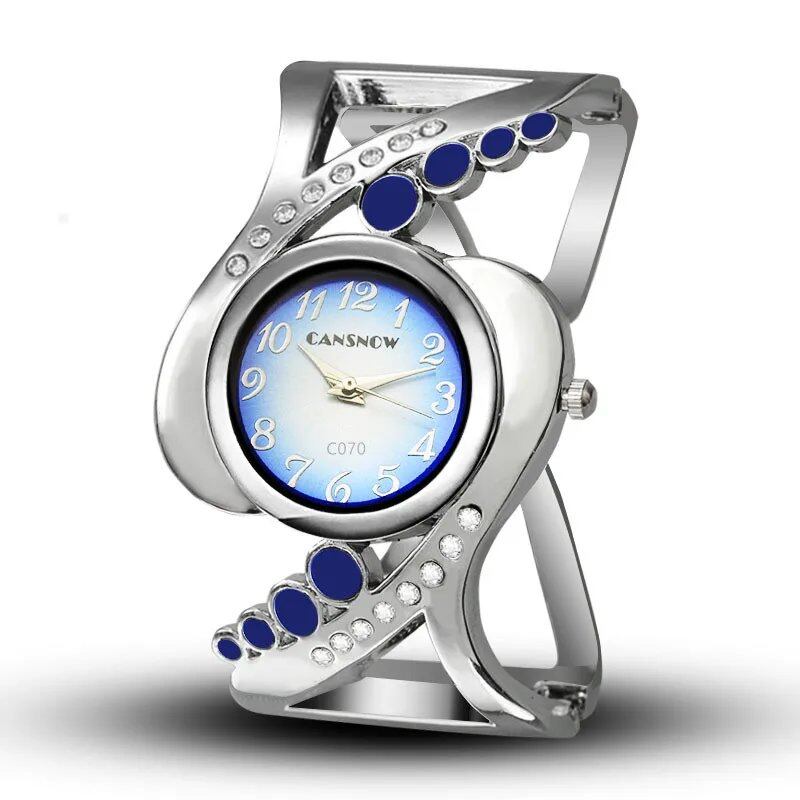 New Design Women's Bangle Quartz Wristwatch with Crystal and Rhinestone Detail. Popular and Elegant. Imported.