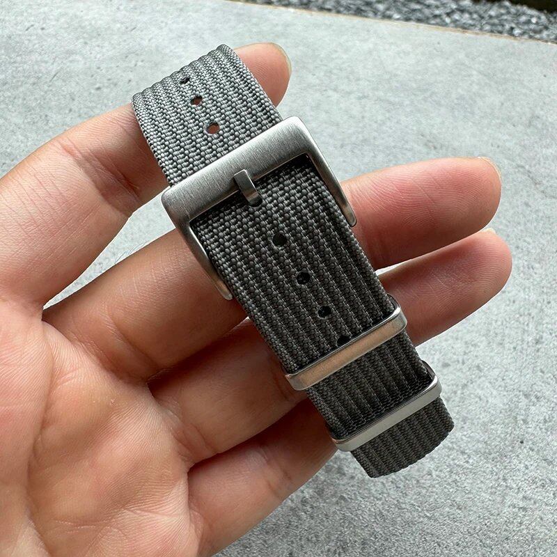 Fashion sports watch band in black, yellow, and gray. Ribbed nylon strap compatible with Blancpain, Omega, and Swatch models. Band color: mm. Ships from: Parallel import.