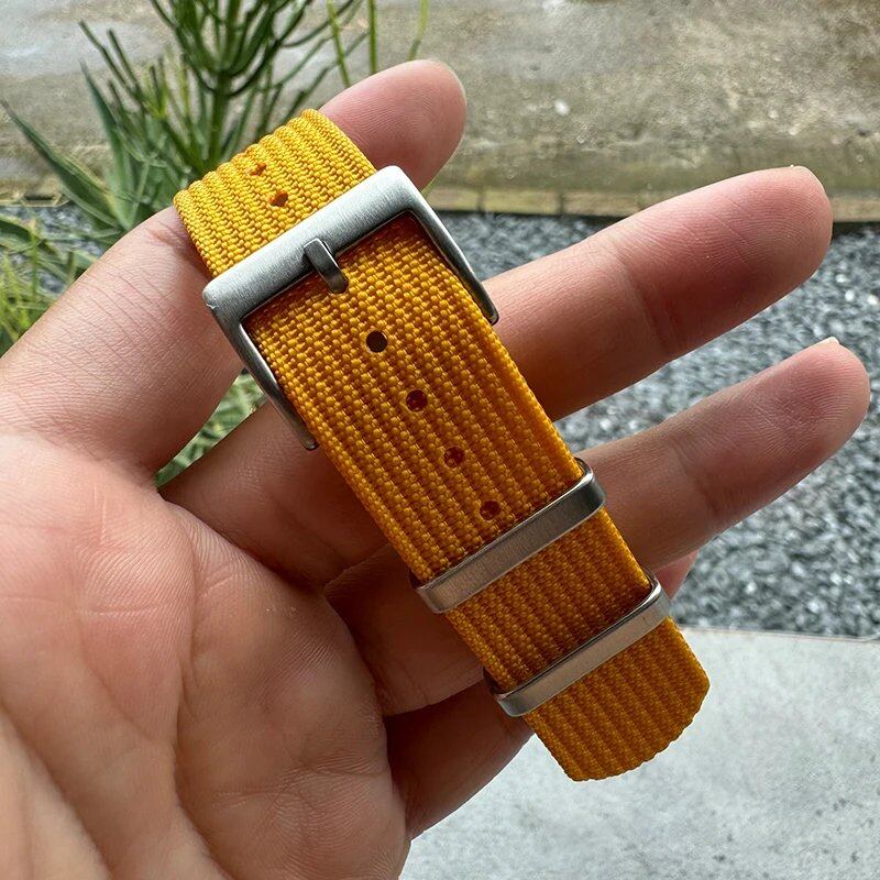 Fashion sports watch band in black, yellow, and gray. Ribbed nylon strap compatible with Blancpain, Omega, and Swatch models. Band color: mm. Ships from: Parallel import.