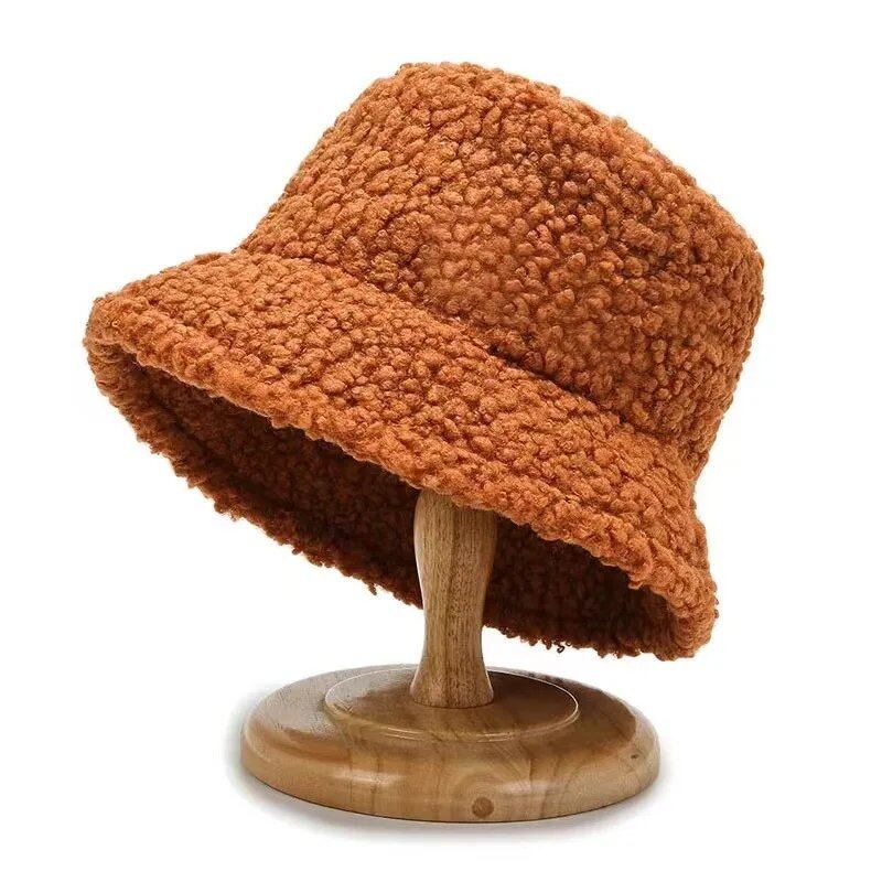 Lambswool unisex bucket hat for men and women, perfect for winter, outdoor activities, and sun protection. Panama fisherman's cap with embroidered lettering. Wholesale chapeau. Sizes: 56-58cm; Parallel import.