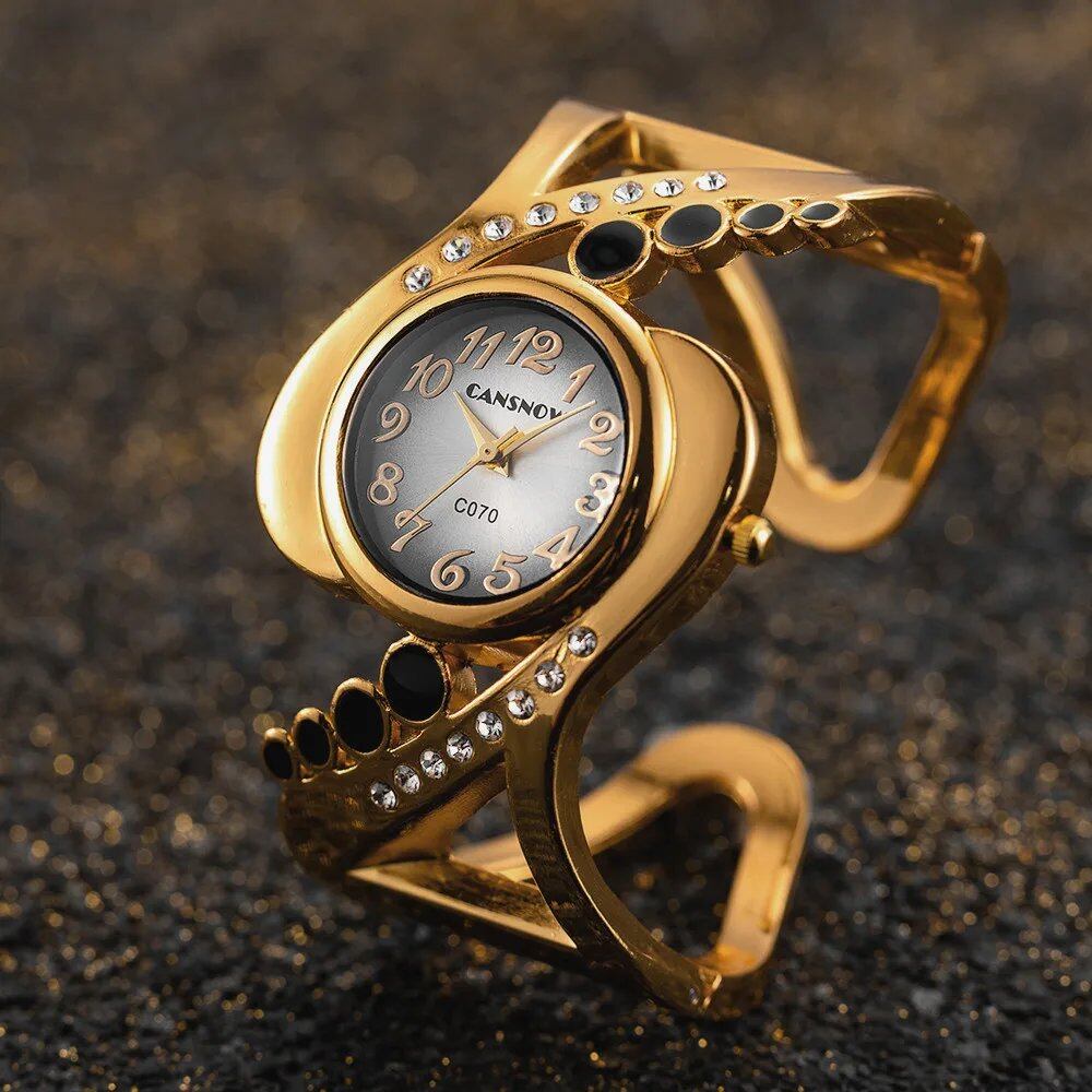New Design Women's Bangle Quartz Wristwatch with Crystal and Rhinestone Detail. Popular and Elegant. Imported.