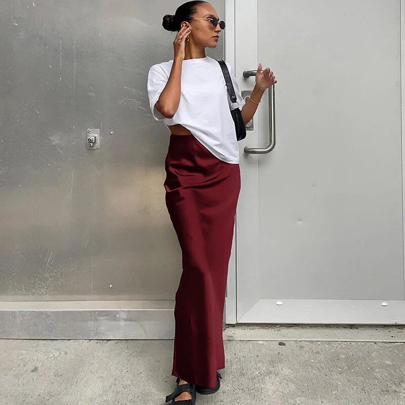 Elegant black satin trumpet skirt for women. Slim, high-waisted, long skirt for spring and summer. Solid color. Size: Parallel import.