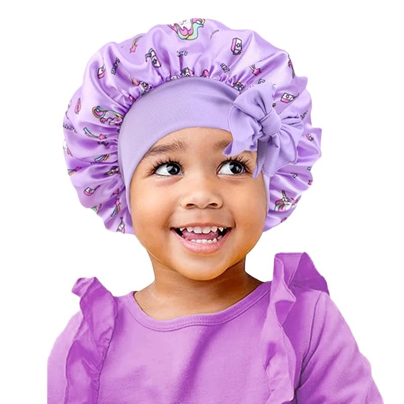 New Kids Unicorn Satin Bonnet with Wide Elastic Band and Ribbon, Perfect for Curly and Natural Hair, Perfect as a Nightcap, Shower Cap, or Headscarf. One Size; Imported.