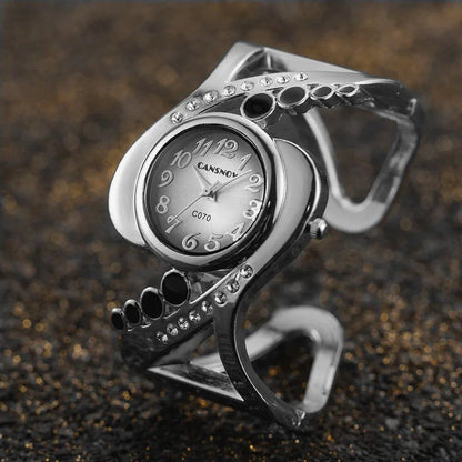 New Design Women's Bangle Quartz Wristwatch with Crystal and Rhinestone Detail. Popular and Elegant. Imported.