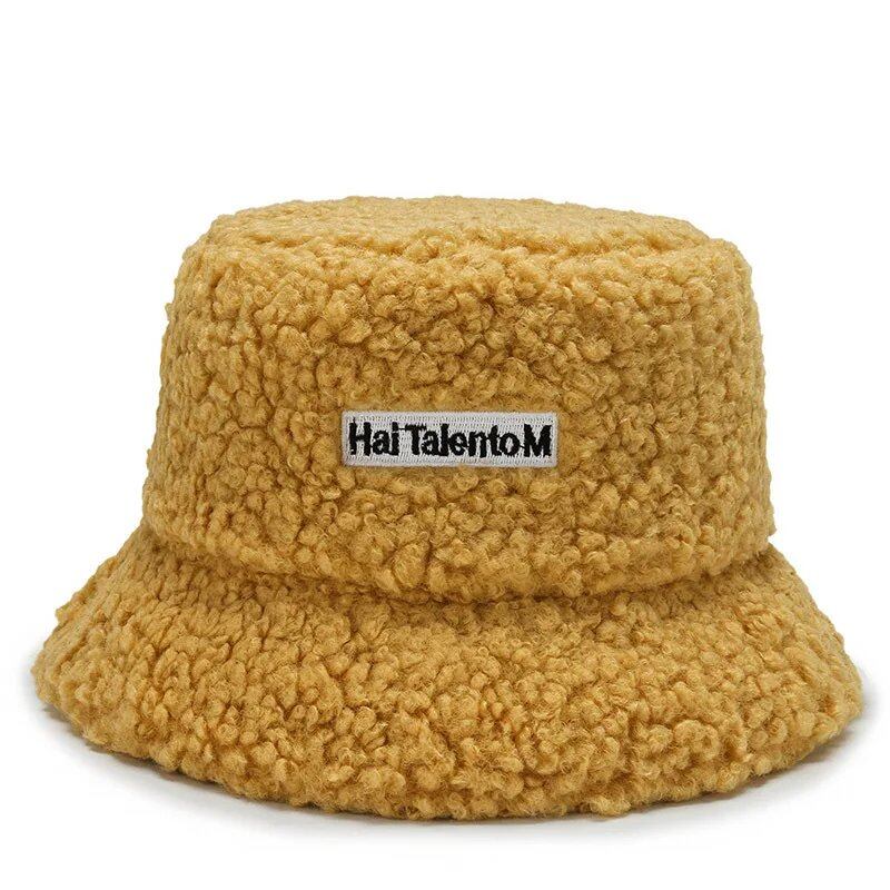 Lambswool unisex bucket hat for men and women, perfect for winter, outdoor activities, and sun protection. Panama fisherman's cap with embroidered lettering. Wholesale chapeau. Sizes: 56-58cm; Parallel import.