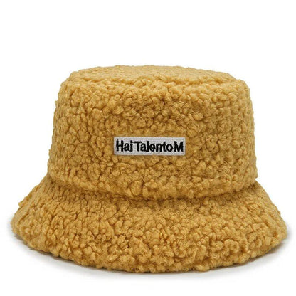 Lambswool unisex bucket hat for men and women, perfect for winter, outdoor activities, and sun protection. Panama fisherman's cap with embroidered lettering. Wholesale chapeau. Sizes: 56-58cm; Parallel import.