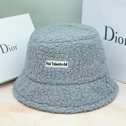 Lambswool unisex bucket hat for men and women, perfect for winter, outdoor activities, and sun protection. Panama fisherman's cap with embroidered lettering. Wholesale chapeau. Sizes: 56-58cm; Parallel import.